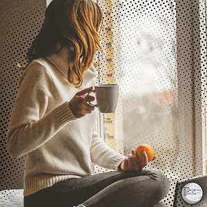 4 woman with coffee in front of window